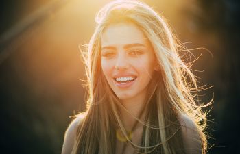Happy young woman with a perfect smile.